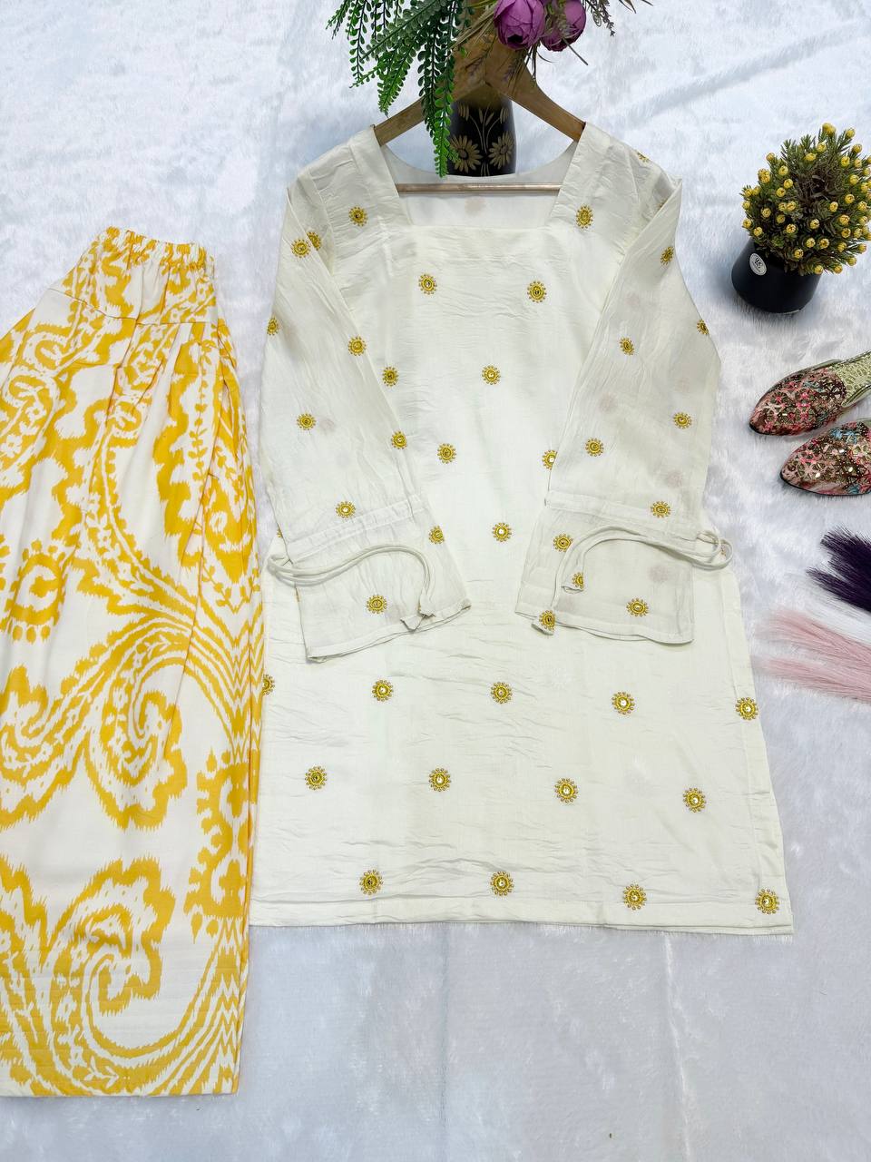 Radiant Ivory White Short Kurti Adorned with Sunshine Yellow Embroidery Paired with a Flowy Patterned Farshi Salwar